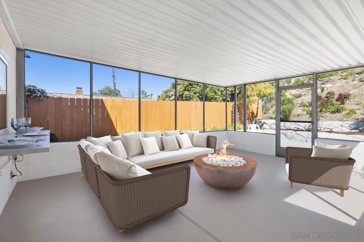 3252 Eichenlaub Street San Diego, CA 92117 - Photo 20 of 36 a living room with furniture and a large window