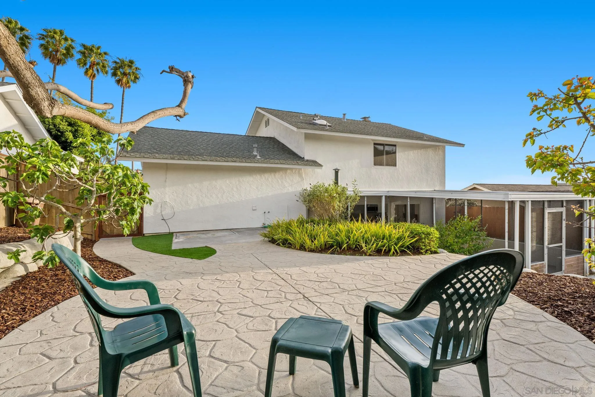 3252 Eichenlaub Street San Diego, CA 92117 - Photo 24 of 36 a view of a chairs and table in the patio