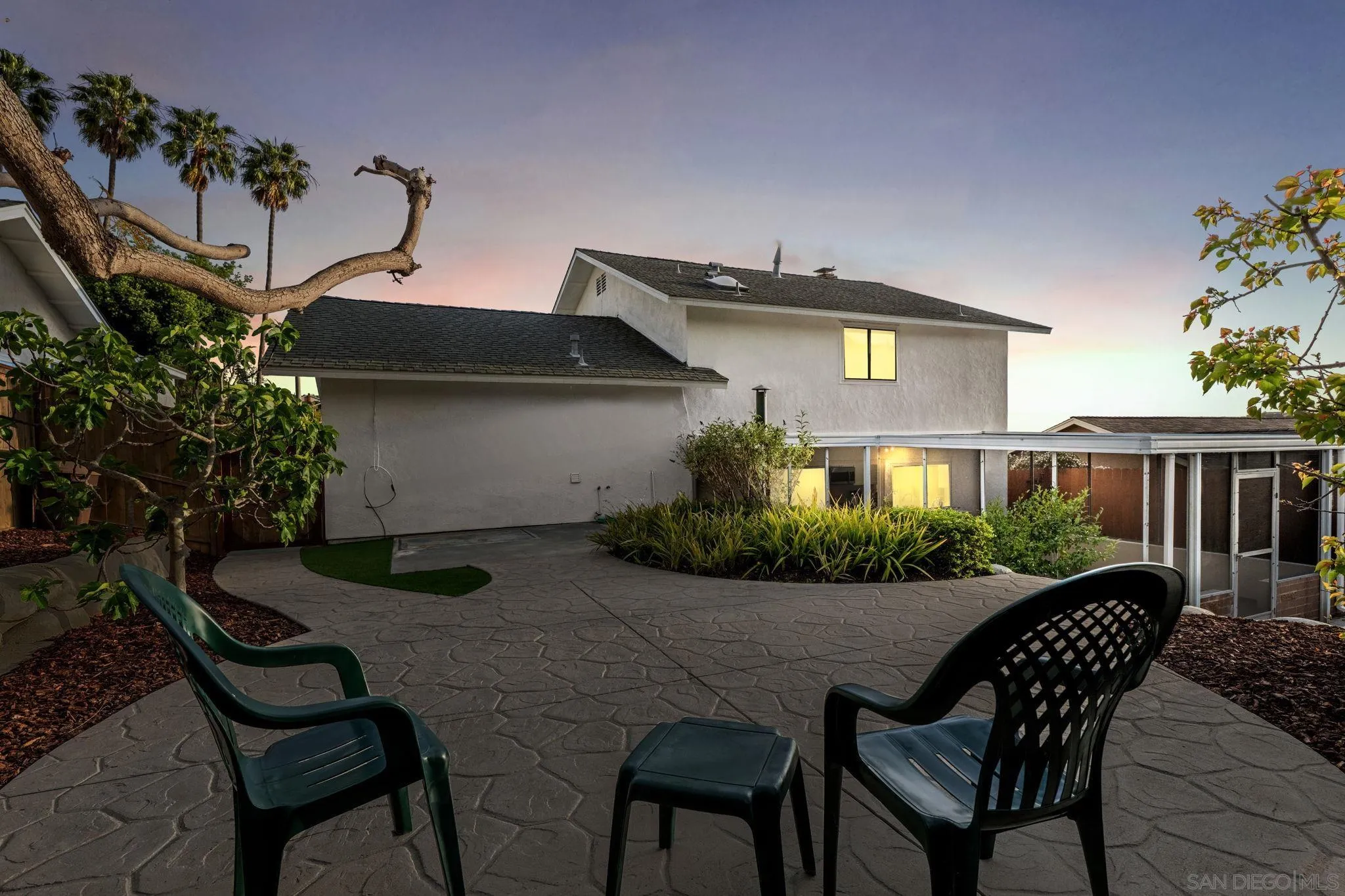 3252 Eichenlaub Street San Diego, CA 92117 - Photo 31 of 36 a view of a chairs and table in the back yard of the house