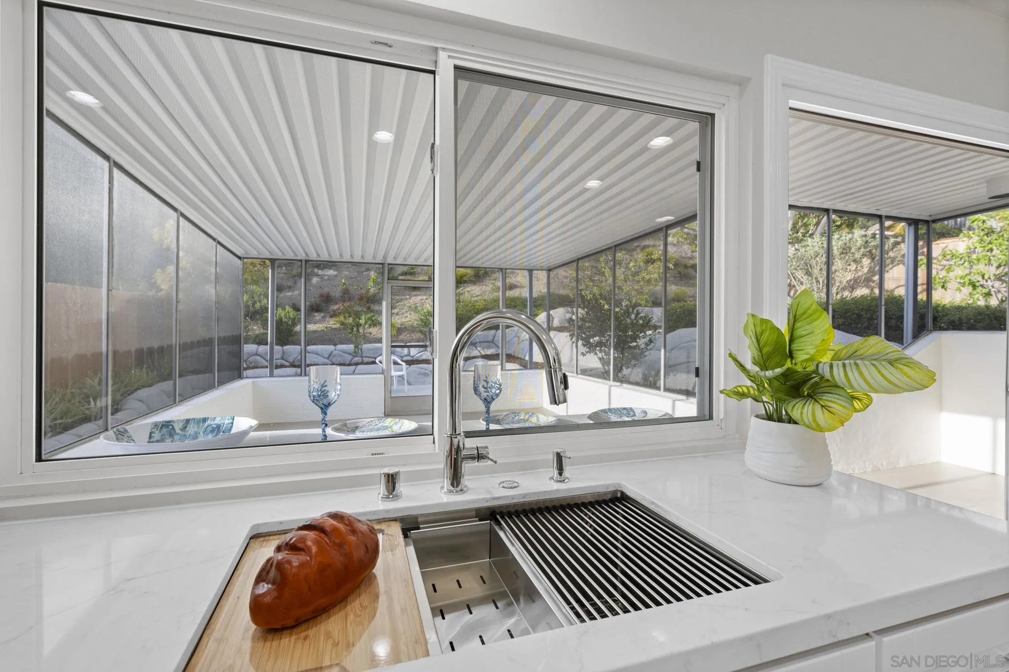 3252 Eichenlaub Street San Diego, CA 92117 - Photo 33 of 36 a view of a living room and a potted plant