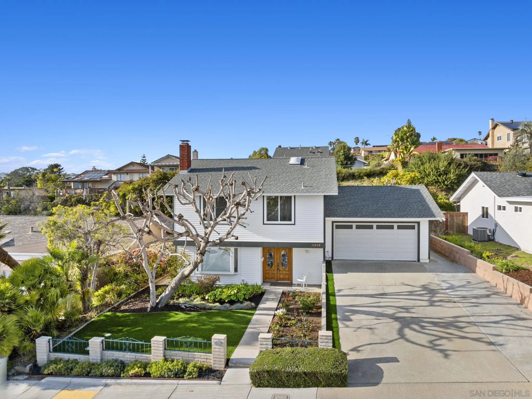 3252 Eichenlaub Street San Diego, CA 92117 - Photo 5 of 36 front view of a house with a street