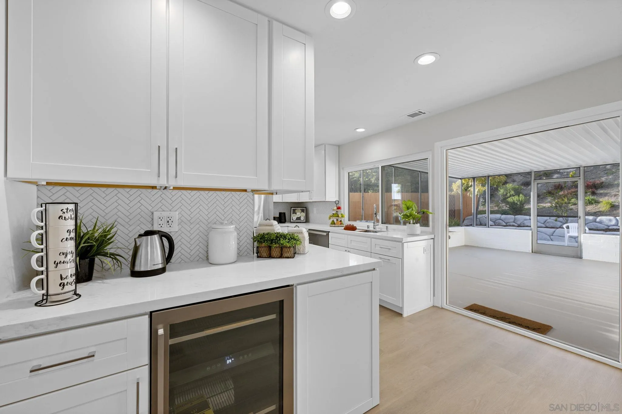 3252 Eichenlaub Street San Diego, CA 92117 - Photo 7 of 36 a kitchen with sink and cabinets