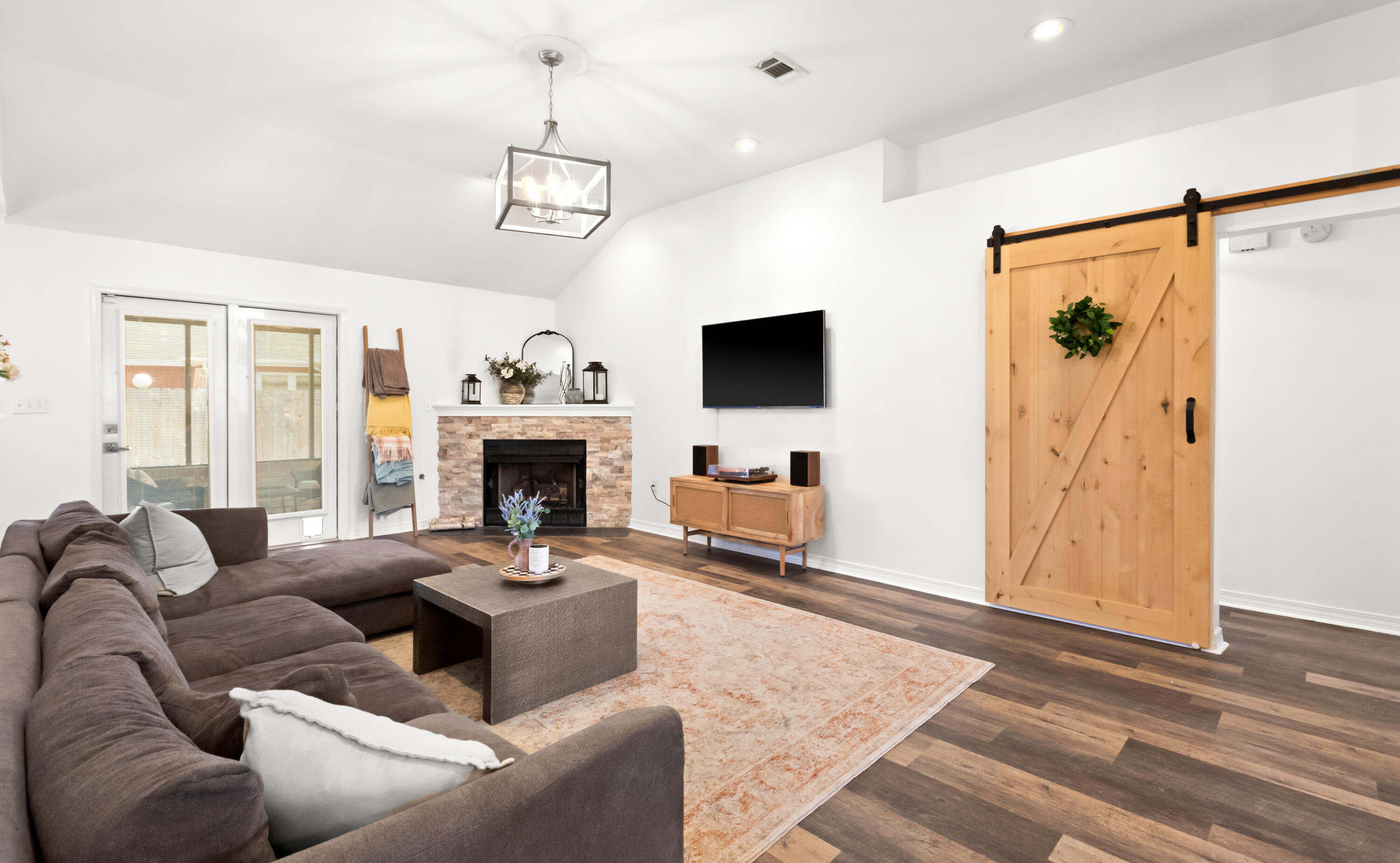 380 Sonora Road Destin, FL 32541 - Photo 11 of 62 a living room with furniture a fireplace and a flat screen tv