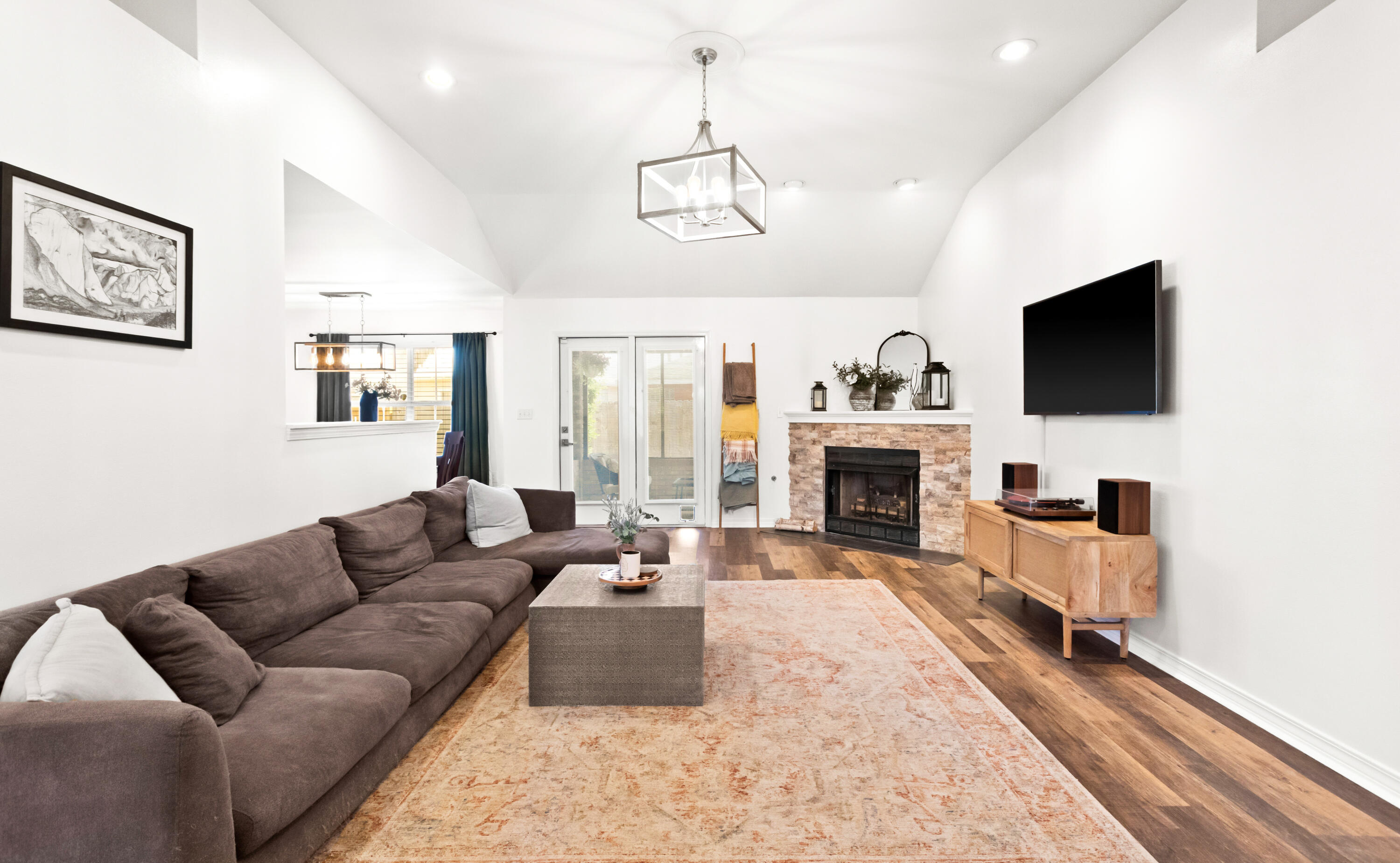380 Sonora Road Destin, FL 32541 - Photo 12 of 62 a living room with furniture a fireplace and a flat screen tv
