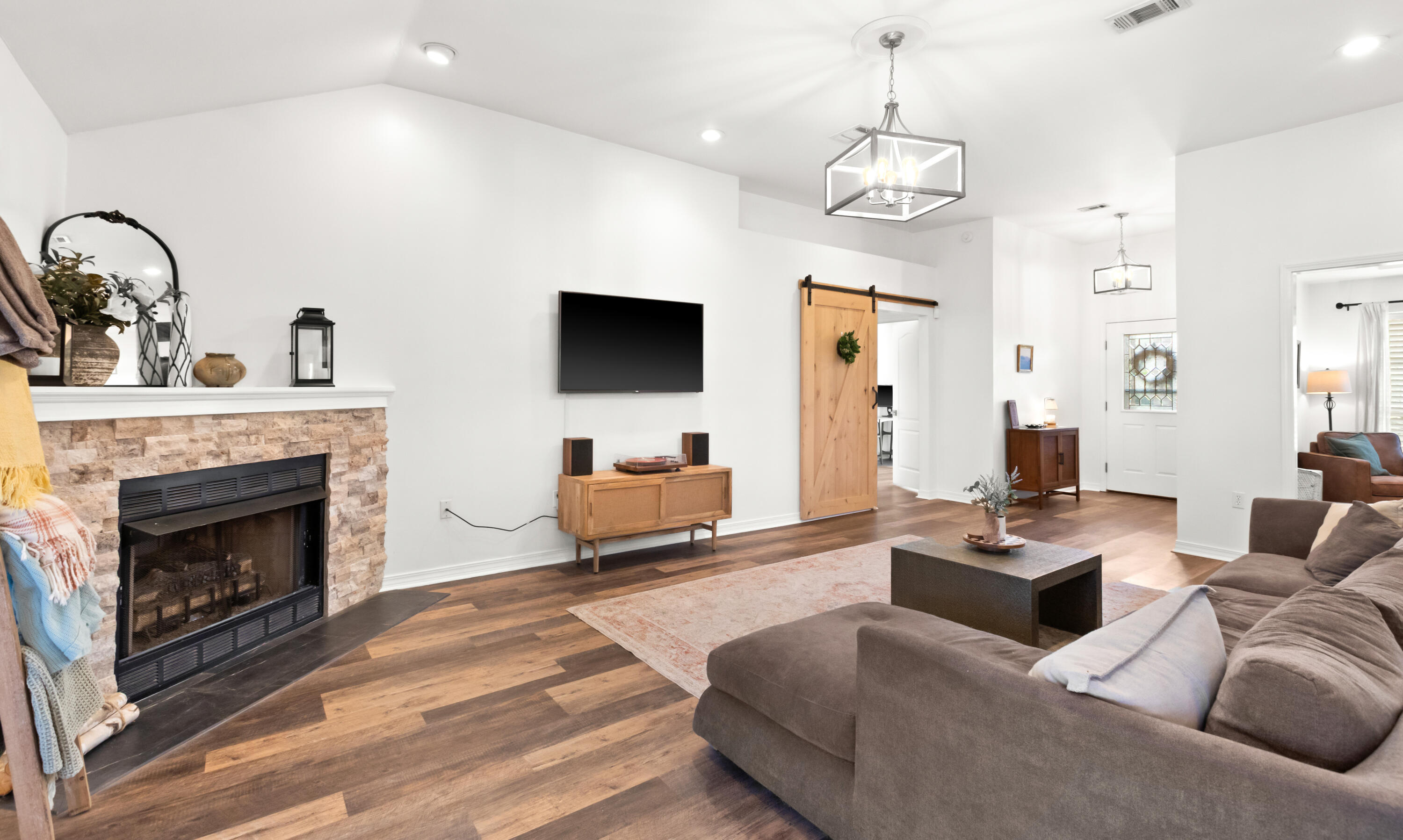 380 Sonora Road Destin, FL 32541 - Photo 16 of 62 a living room with furniture a fireplace and a flat screen tv