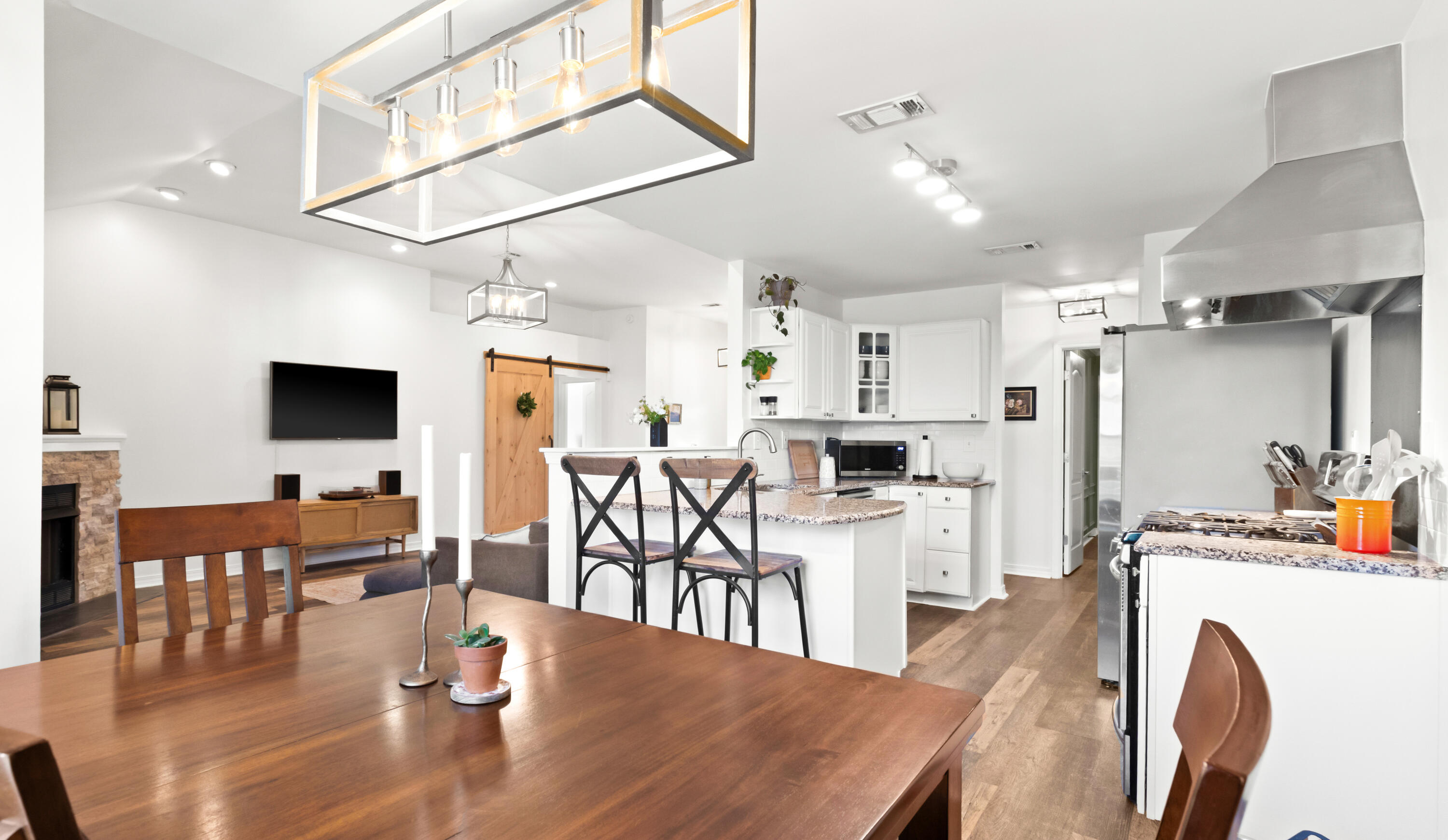 380 Sonora Road Destin, FL 32541 - Photo 19 of 62 a kitchen with stainless steel appliances granite countertop a dining table chairs microwave and cabinets