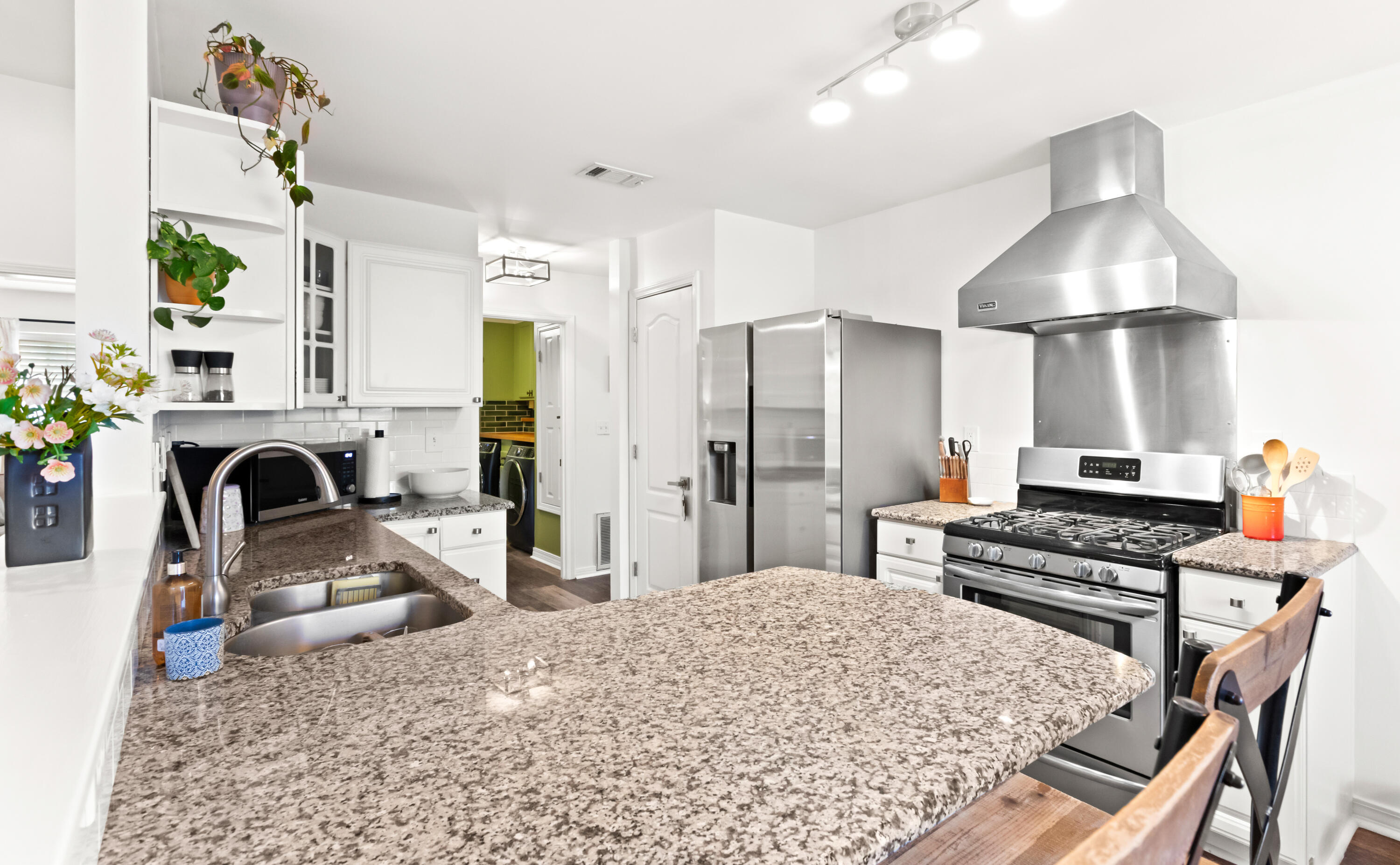 380 Sonora Road Destin, FL 32541 - Photo 22 of 62 a kitchen with a stove a refrigerator and a fireplace