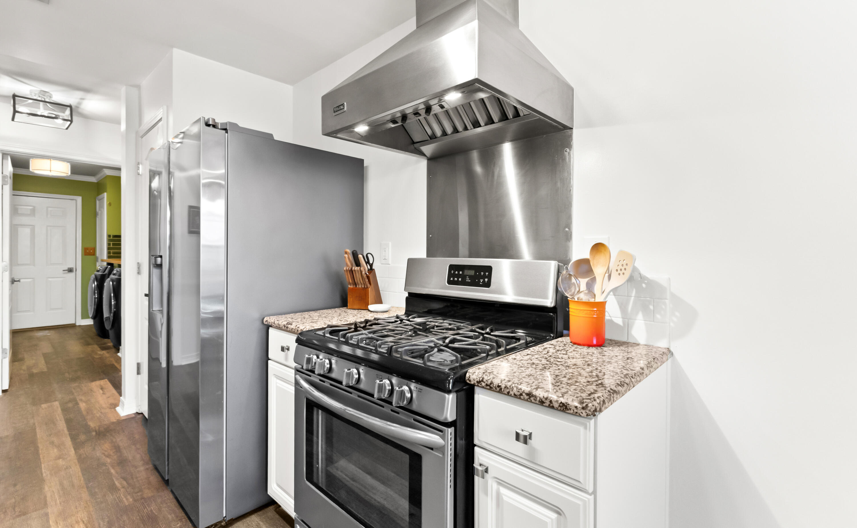 380 Sonora Road Destin, FL 32541 - Photo 23 of 62 a kitchen with stainless steel appliances granite countertop a stove and a refrigerator