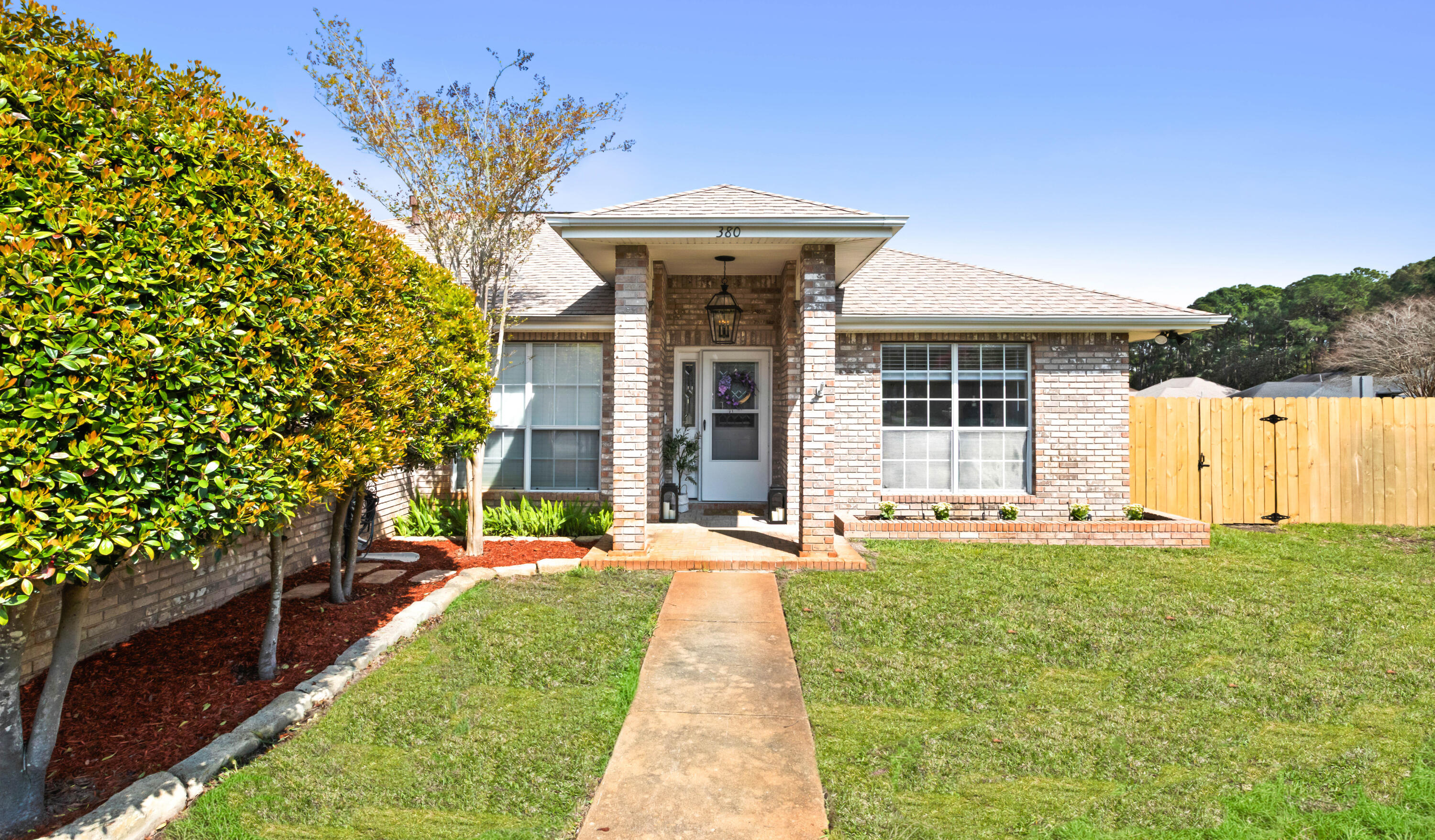 380 Sonora Road Destin, FL 32541 - Photo 3 of 62 a front view of a house with a yard