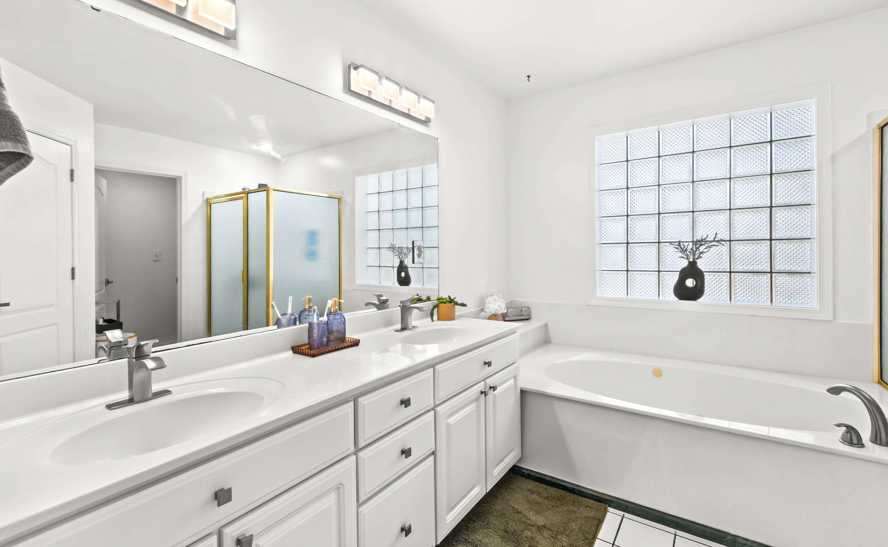 380 Sonora Road Destin, FL 32541 - Photo 35 of 62 a bathroom with a double vanity sink mirror double and bathtub