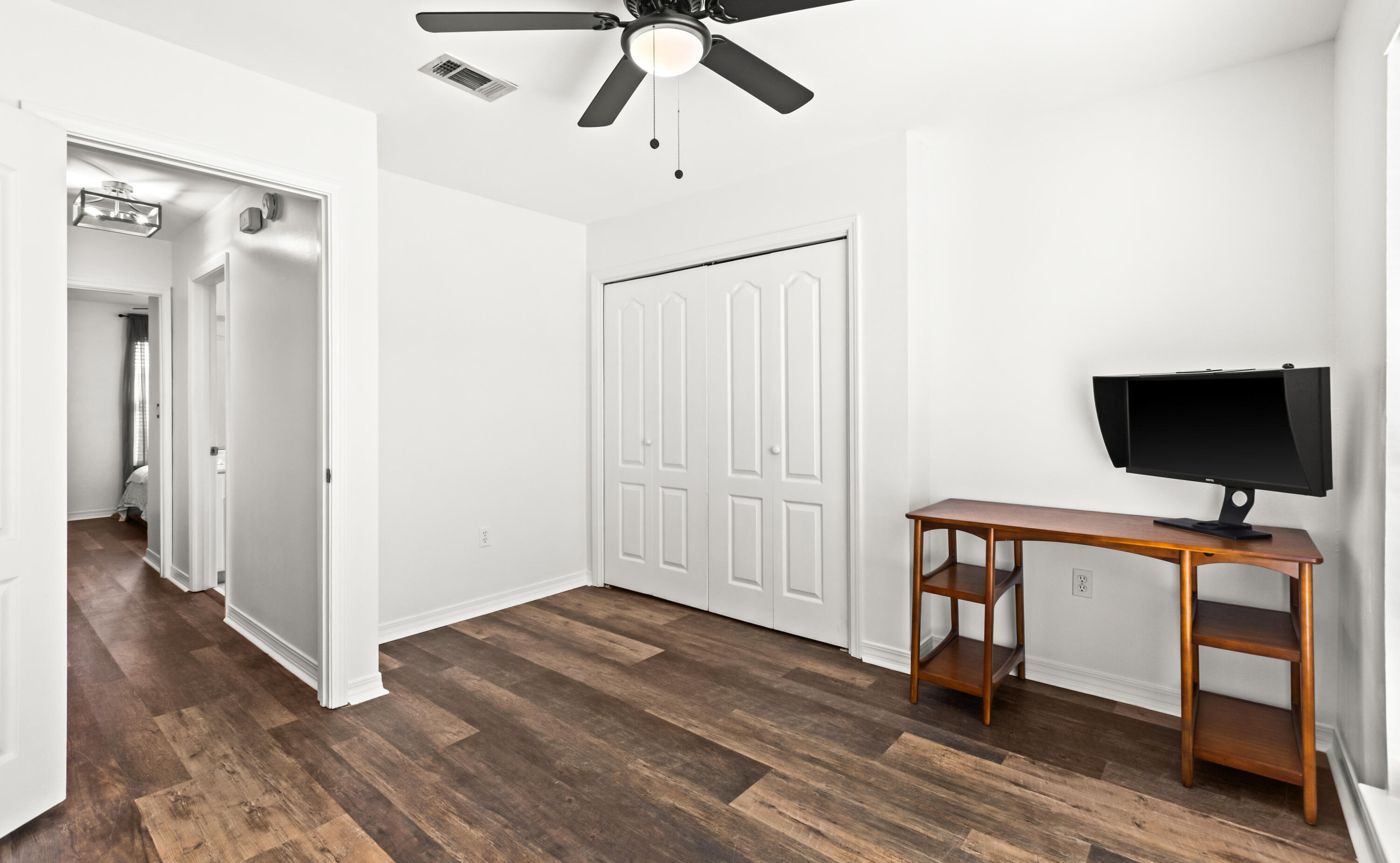 380 Sonora Road Destin, FL 32541 - Photo 40 of 62 a view of a livingroom with a hardwood floor and a ceiling fan