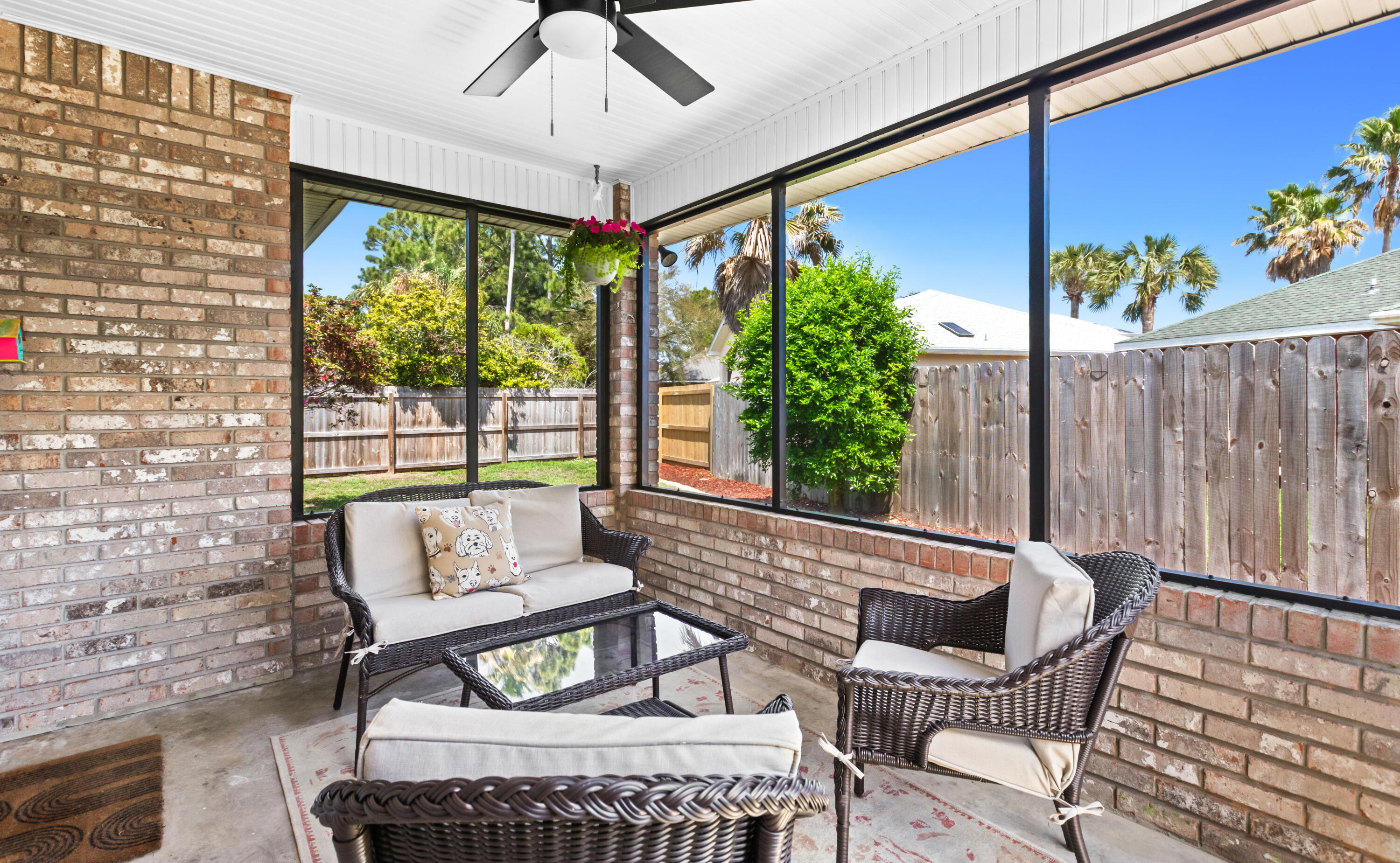 380 Sonora Road Destin, FL 32541 - Photo 50 of 62 a view of a patio with a table and chairs and potted plants