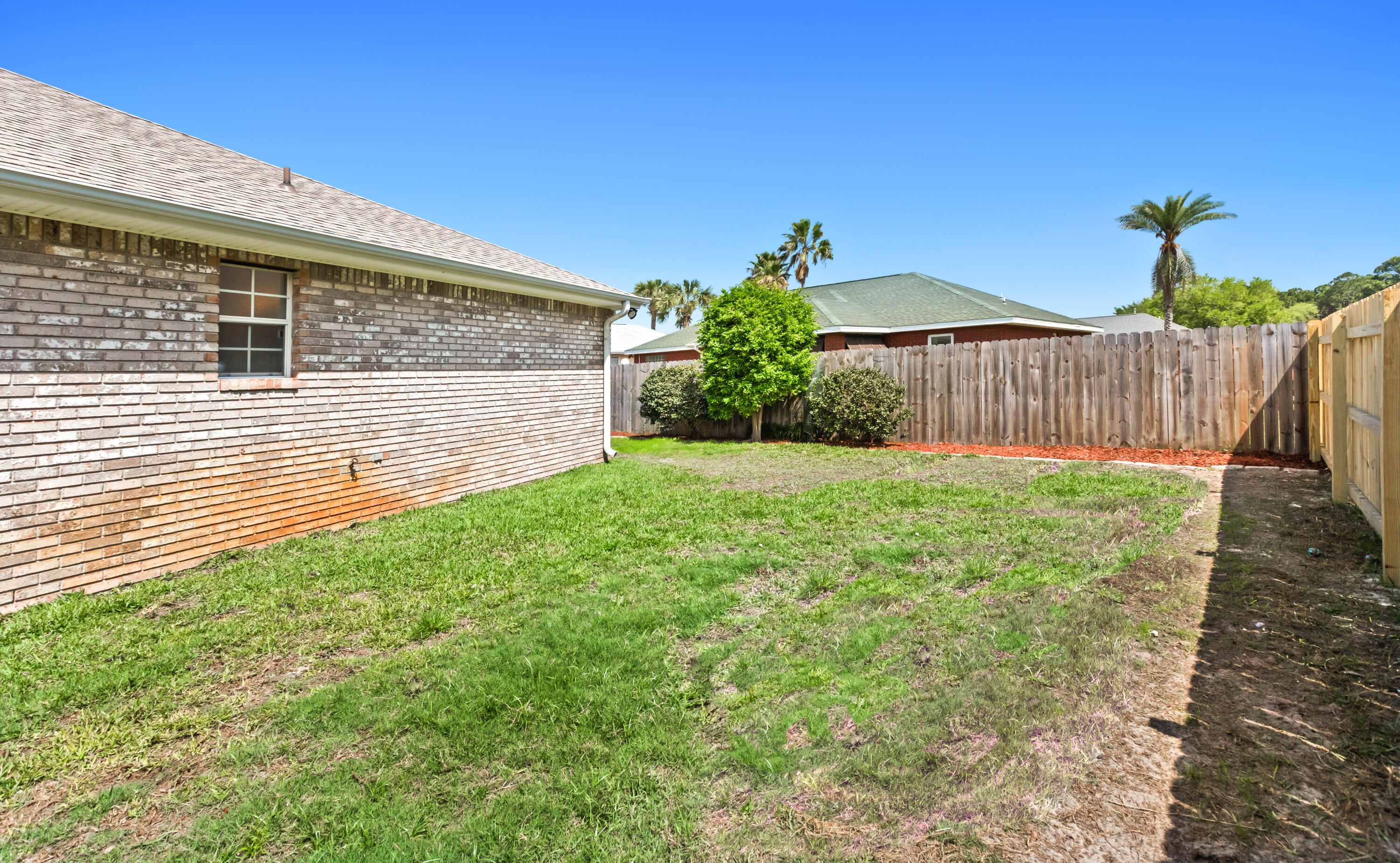 380 Sonora Road Destin, FL 32541 - Photo 54 of 62 a view of a backyard with a garden