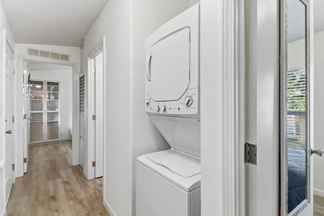 a view of an entryway with wooden floor