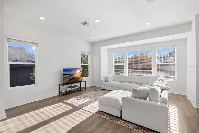 a bedroom with furniture and a window