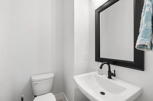 a bathroom with a sink and mirror