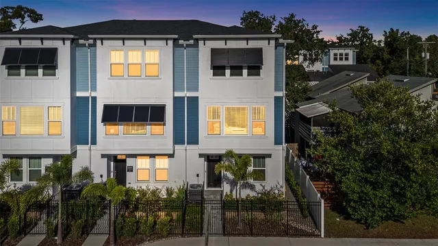 a view of multiple house with a yard