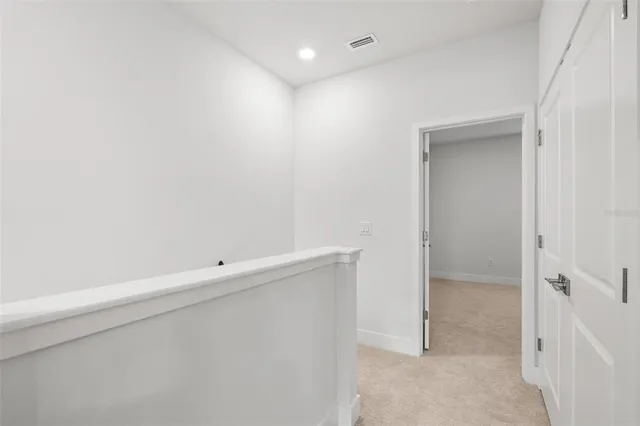 a spacious bathroom with a granite countertop sink mirror and