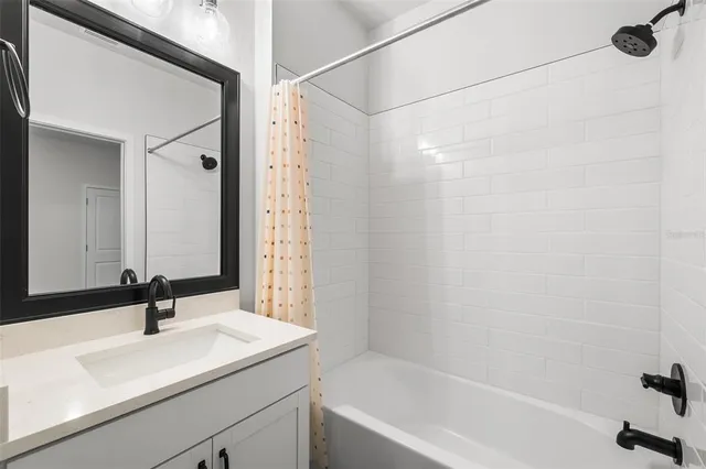a picture of a bathroom with a shower
