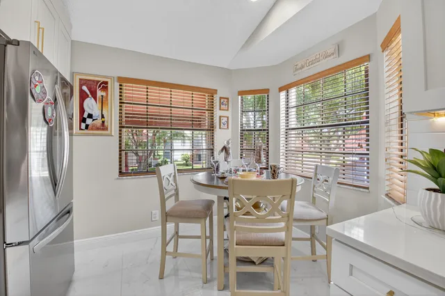 a view of a dining room with furniture window and outside view