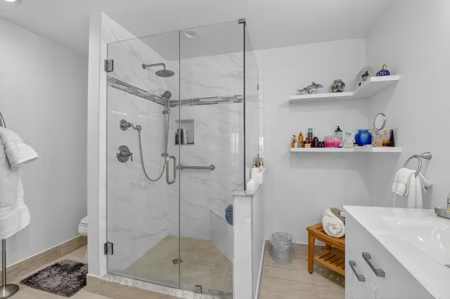 a bathroom with a sink double vanity and a tub