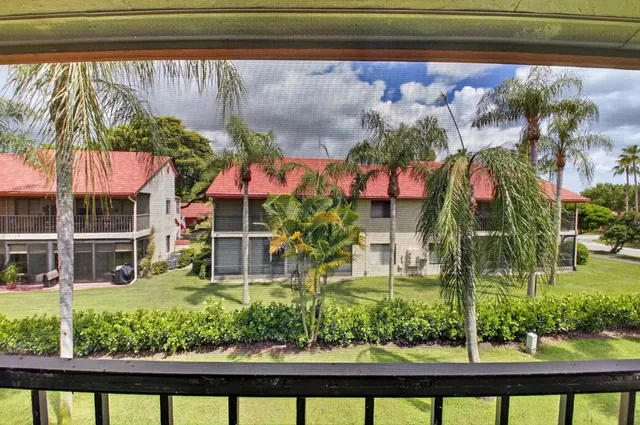 a view of a swimming pool with sitting area