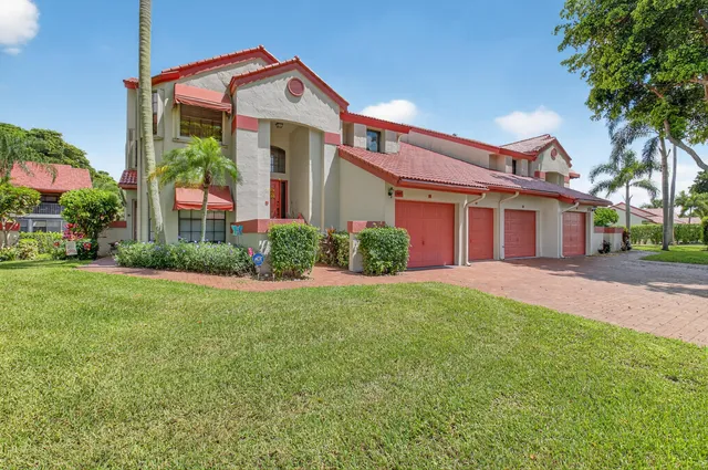 an aerial view of a houses with a swimming pool