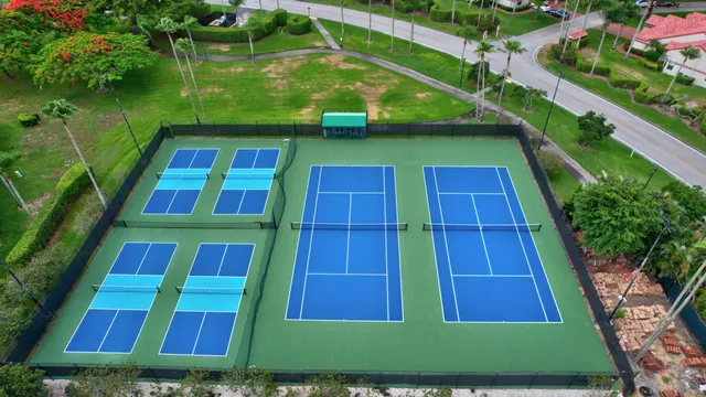 a living room with furniture a bookshelf and a window