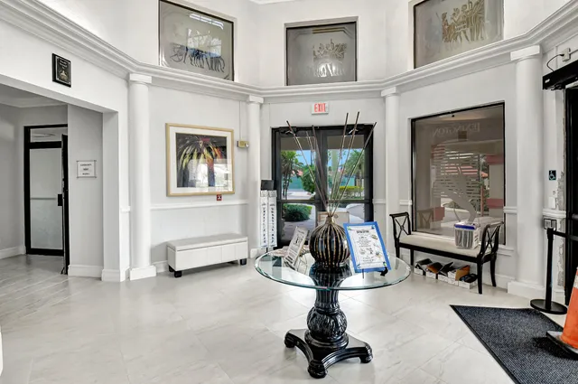 a kitchen with stainless steel appliances granite countertop a sink and wooden cabinets