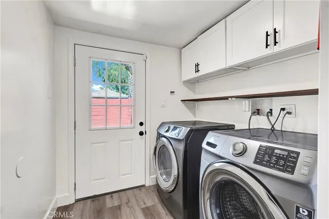 a view of storage and utility room with washer and dryer