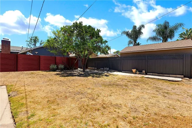 a view of the backyard of a house