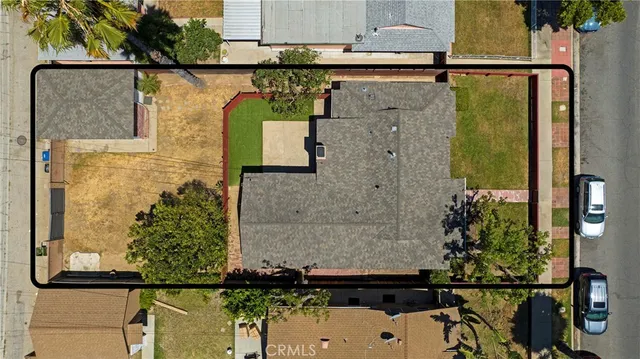 aerial view of a house with large trees
