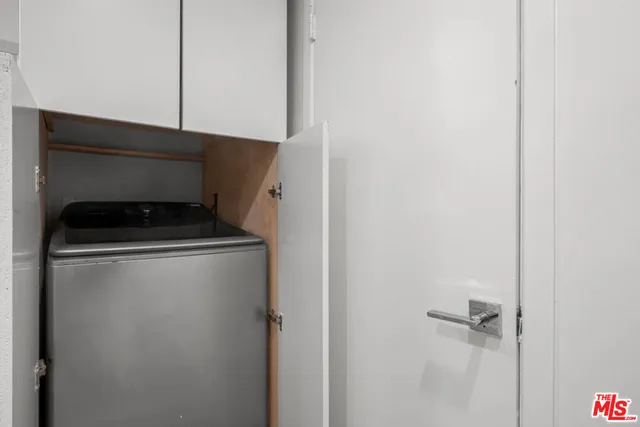 a utility room with washer and dryer