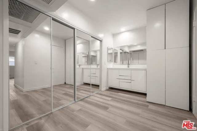a bathroom with a shower and a sink