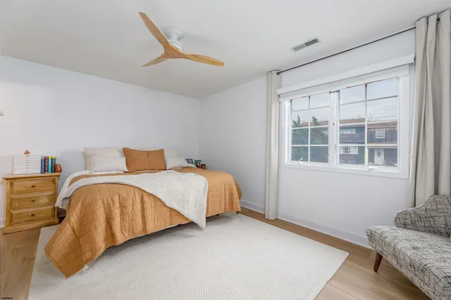 a bed room with a bed and a couch