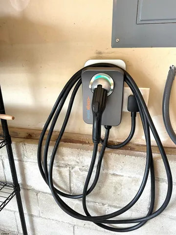 a view of staircase with a washer and dryer