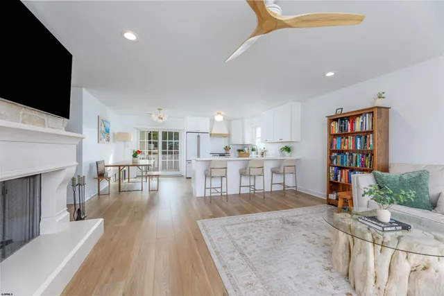 a living room with fireplace furniture and a flat screen tv