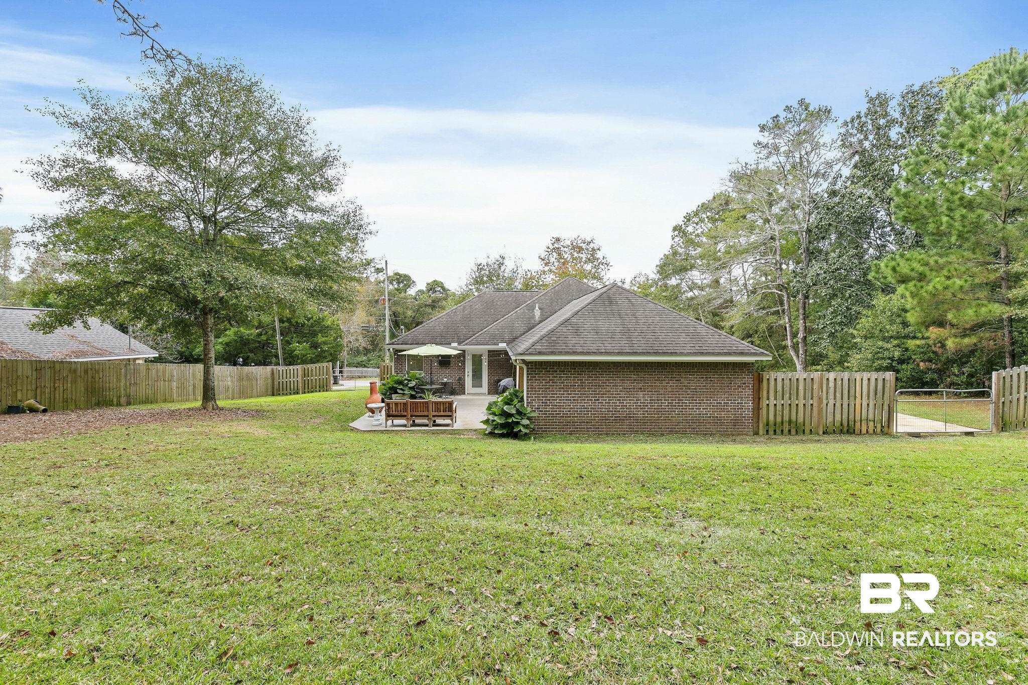 32072 Buzbee Road Daphne, AL 36527 - Photo 30 of 41 View of yard featuring a patio area