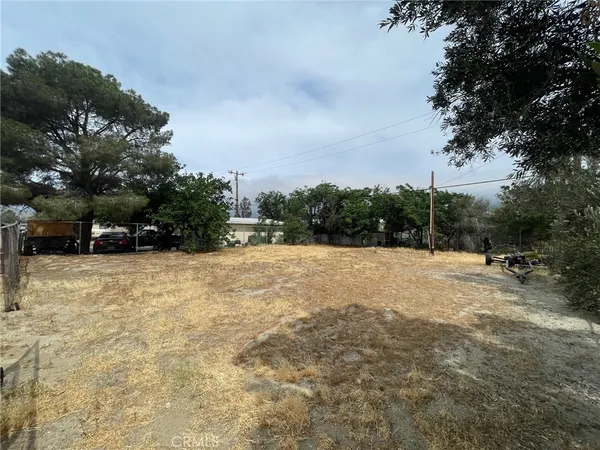 a view of outdoor space with playground and green space