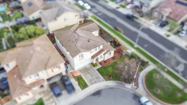 a view of a house with a yard and sitting area