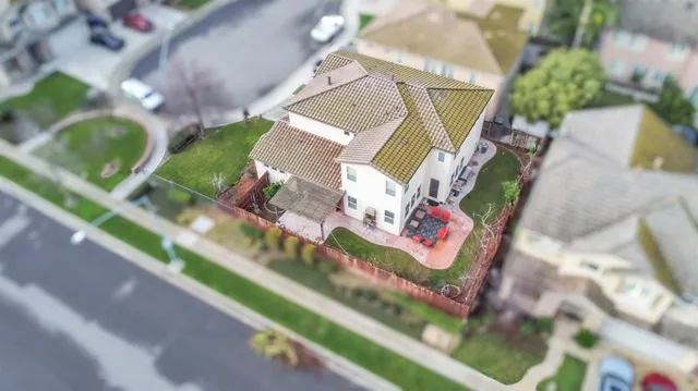 an aerial view of a house with a garden