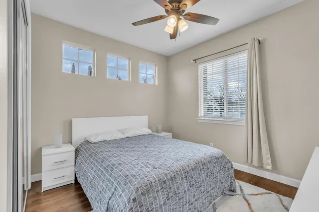 a bedroom with a large bed and a window