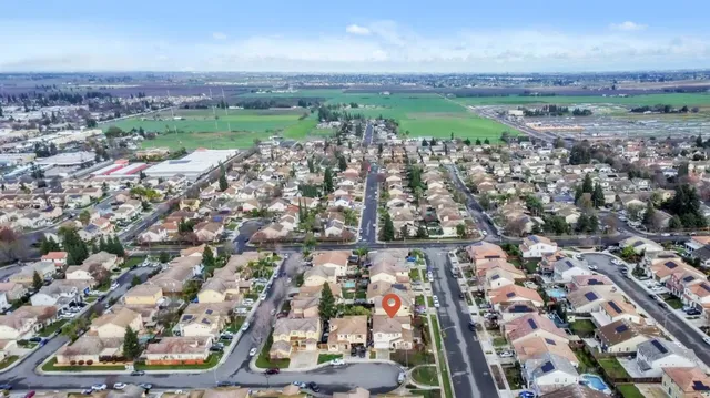 a front view of a house with a garden and pathway