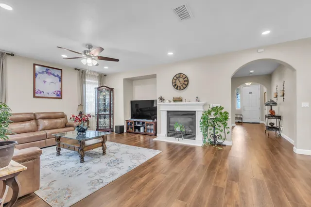 a living room with furniture and a fireplace