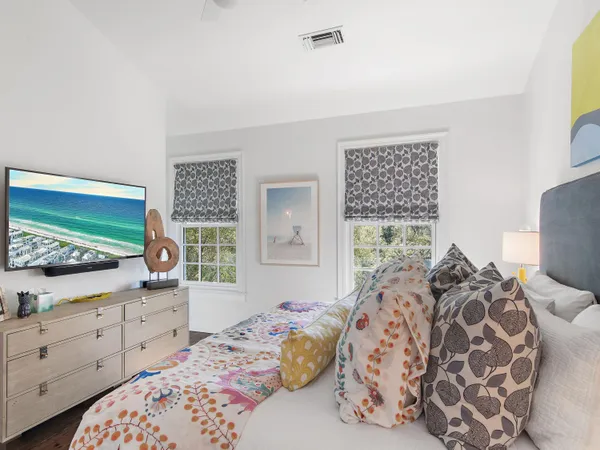 a bedroom with a bed and a dresser