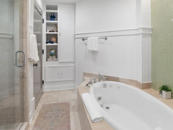 a bathroom with a bathtub and a shower