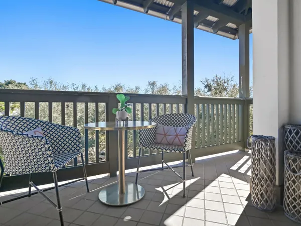 a view of balcony with two chairs