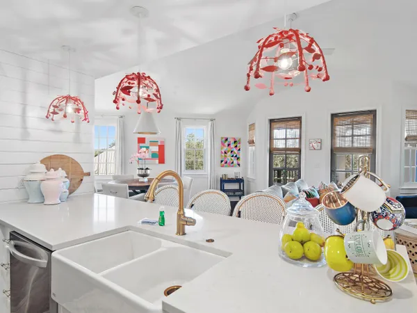 a bathroom with a sink mirror and tub