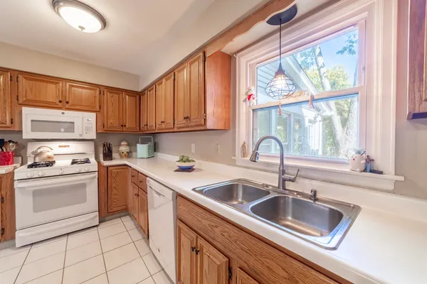 a view of a livingroom with furniture and a window