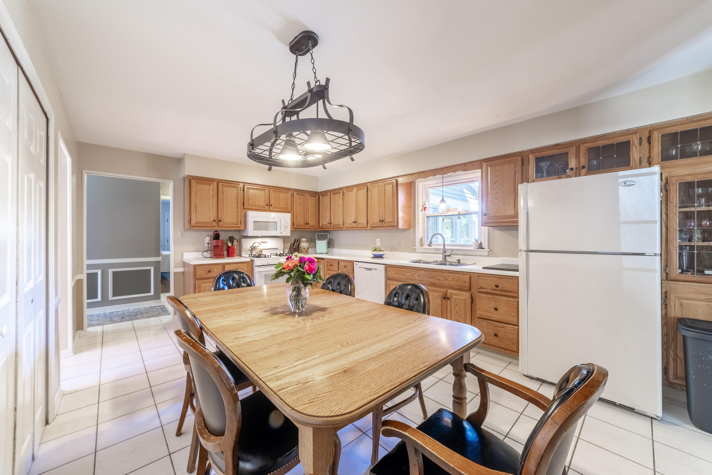 1704 Clover Lane Valparaiso, IN 46385 - Photo 13 of 40 a kitchen with stainless steel appliances granite countertop a dining table and chairs